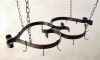 Ceiling mounted wrought iron pot racks with large scrolls