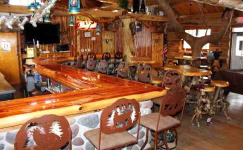 Corner Shot Of Grace rustic Lodge Bar Stools Setup Around Beautiful Wooden Bar