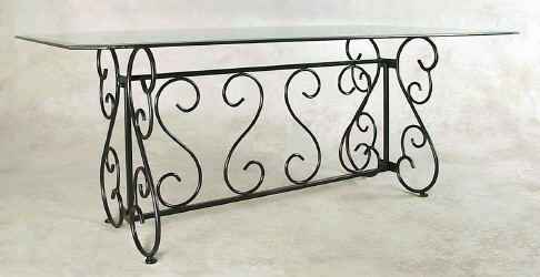 Large wrought iron dining table base with glass top
